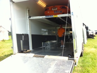 Bob Cahall in Trailer with Car